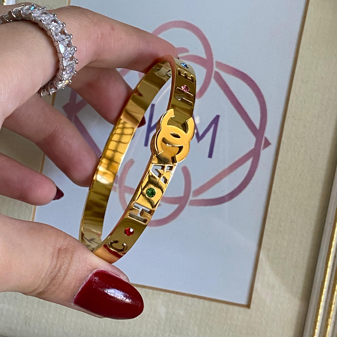 Channel colored stones handcuff