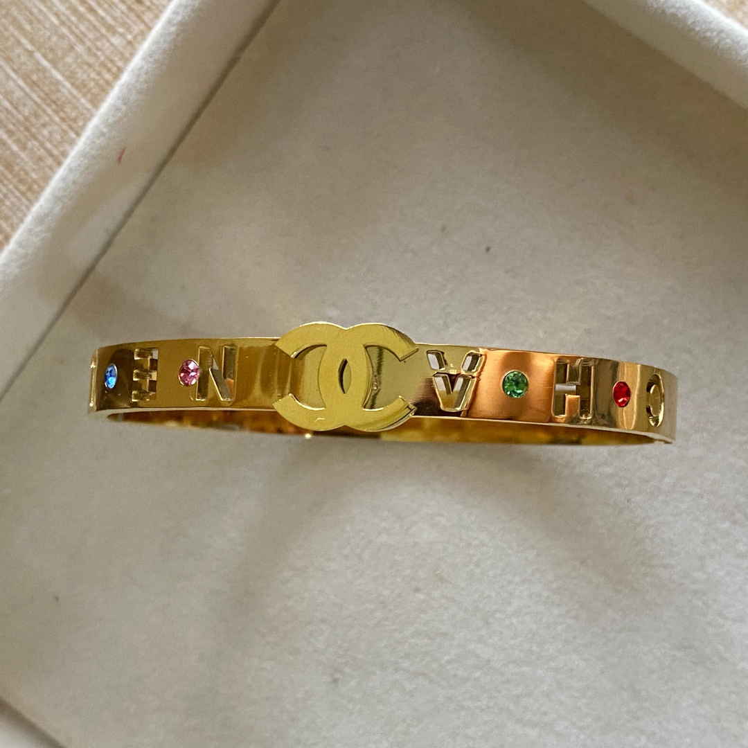 Channel colored stones handcuff