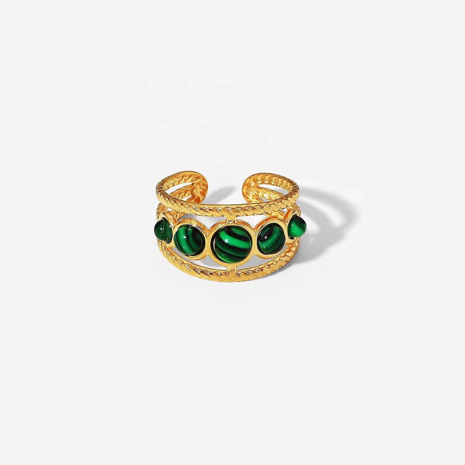 Elegant emerald ring featuring a vibrant green gemstone in a polished setting